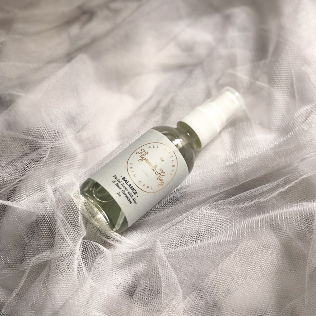 Balance facial toner with aloe and rose geranium packaged in a glass pump spray bottle.
